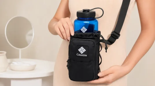 Columbia Trail Traveler: bandolera unisex para botella con correa ajustable, bolsillo secreto y más