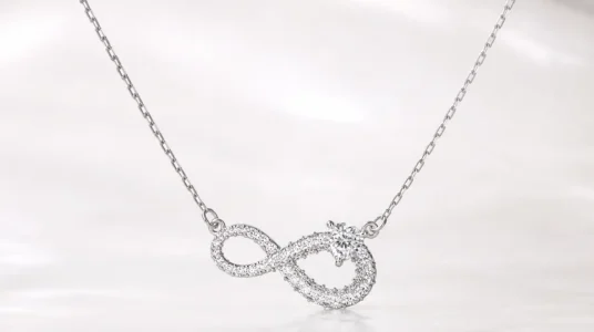Collar Swarovski Infinity con símbolo del infinito y corazón blanco bañado en rodio