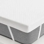Topper viscoelástico multizonas Pikolin Home de 7 cm para cama de 135, desenfundable y transpirable